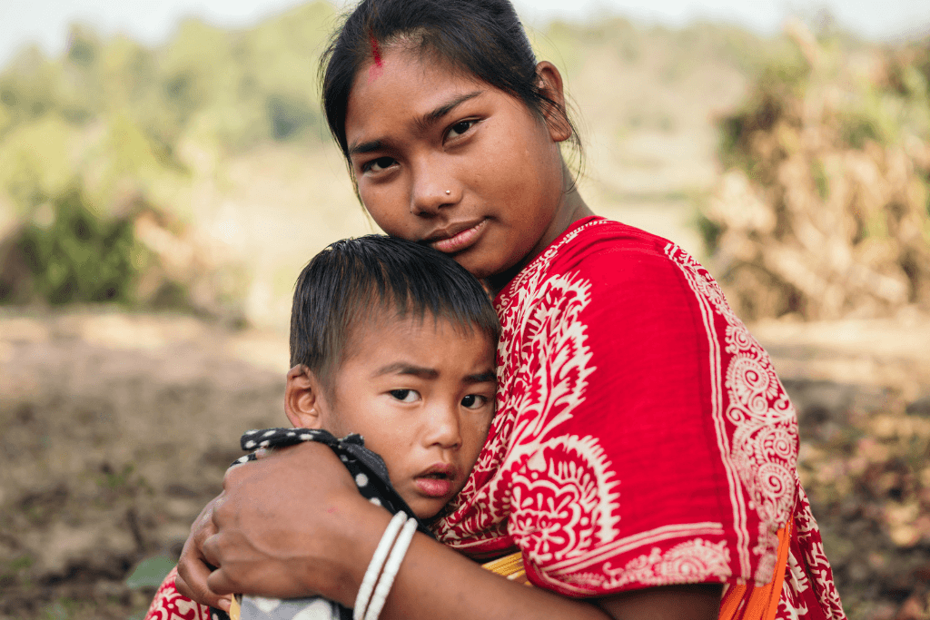 Kohima and baby Joy hug