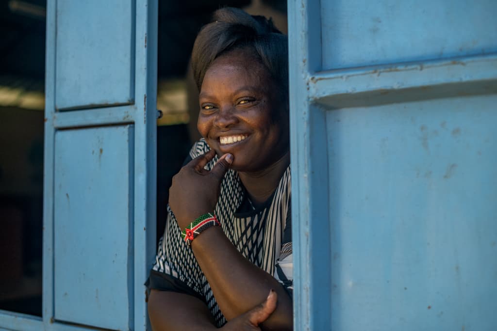 lady smiling in window