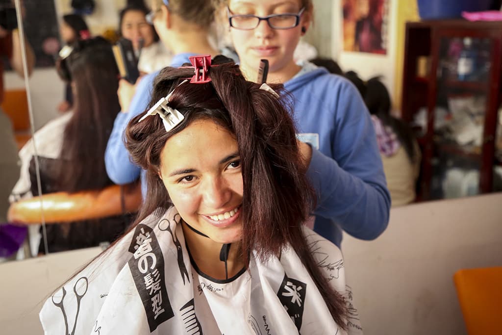 A girl practicing hairdressing
