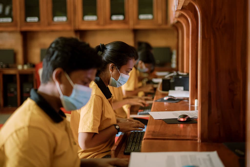 Inggrid with other children at a Compassion computer lab