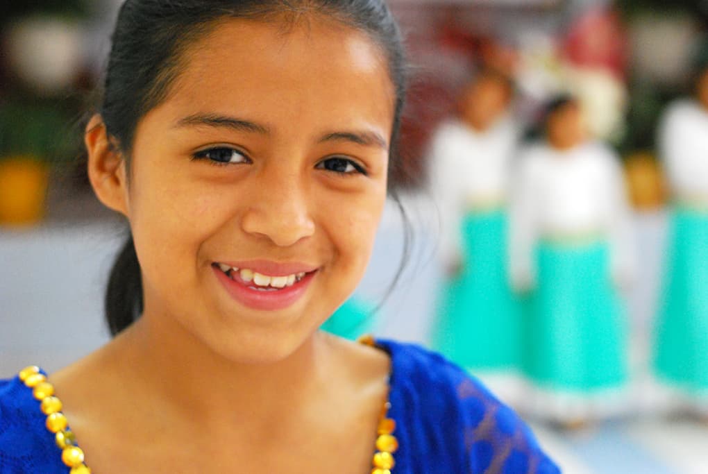 Secia smiling at camera