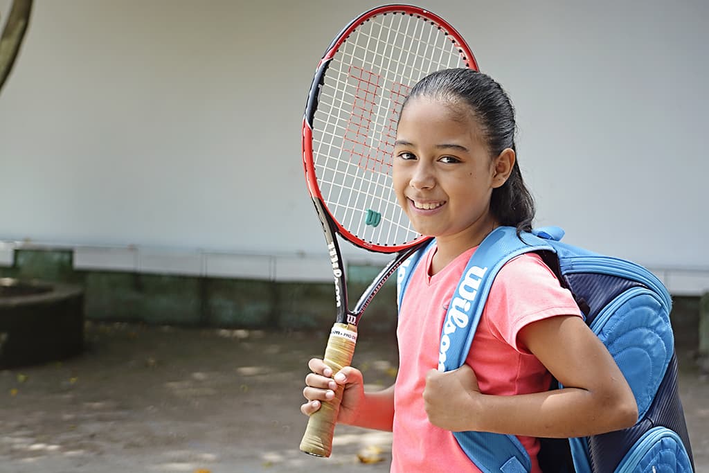 A girl with a tennis racket