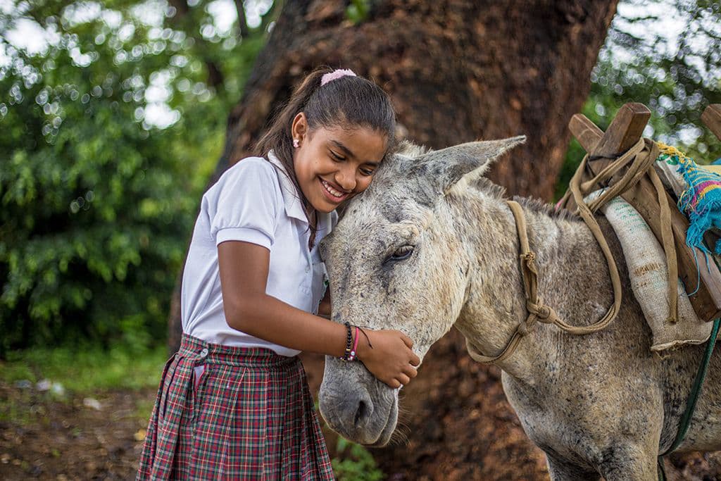 Dianis with her donkey, Mocho.