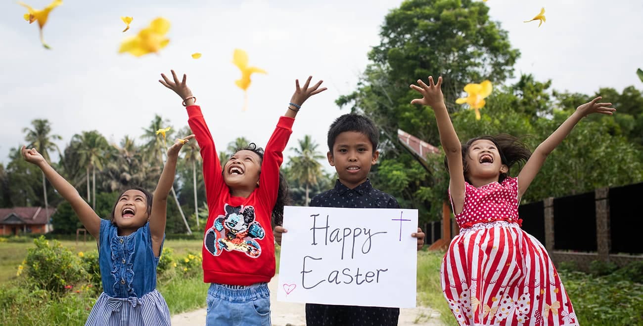 Children with Easter banner
