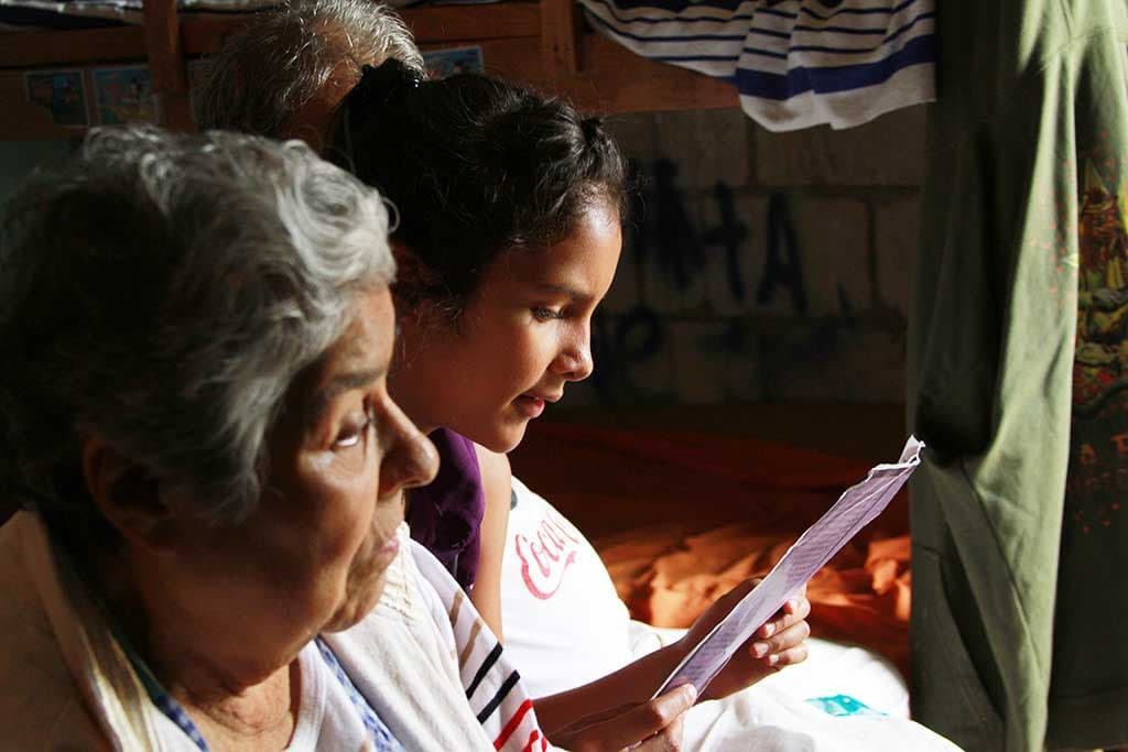 Girl reading sponsor letters