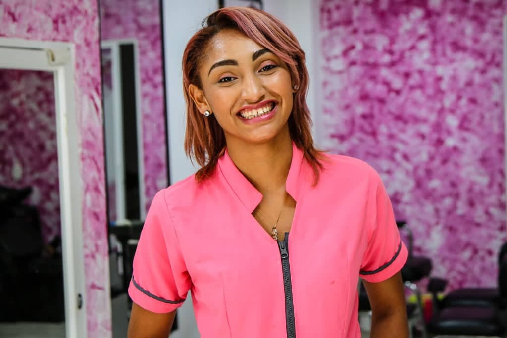 Sandy stands in a beauty salon