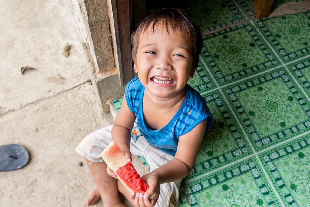 Child eating watermelon Philippines