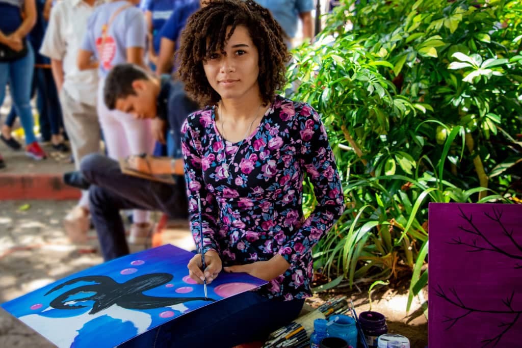 Sandra paints outside