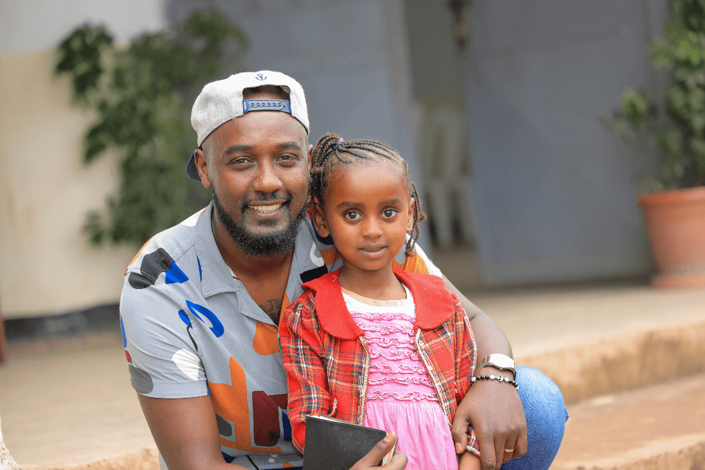 Kemi with the child he sponsors