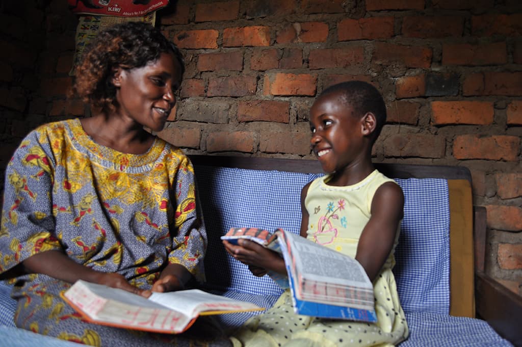 Mum and daughter reading the Bible