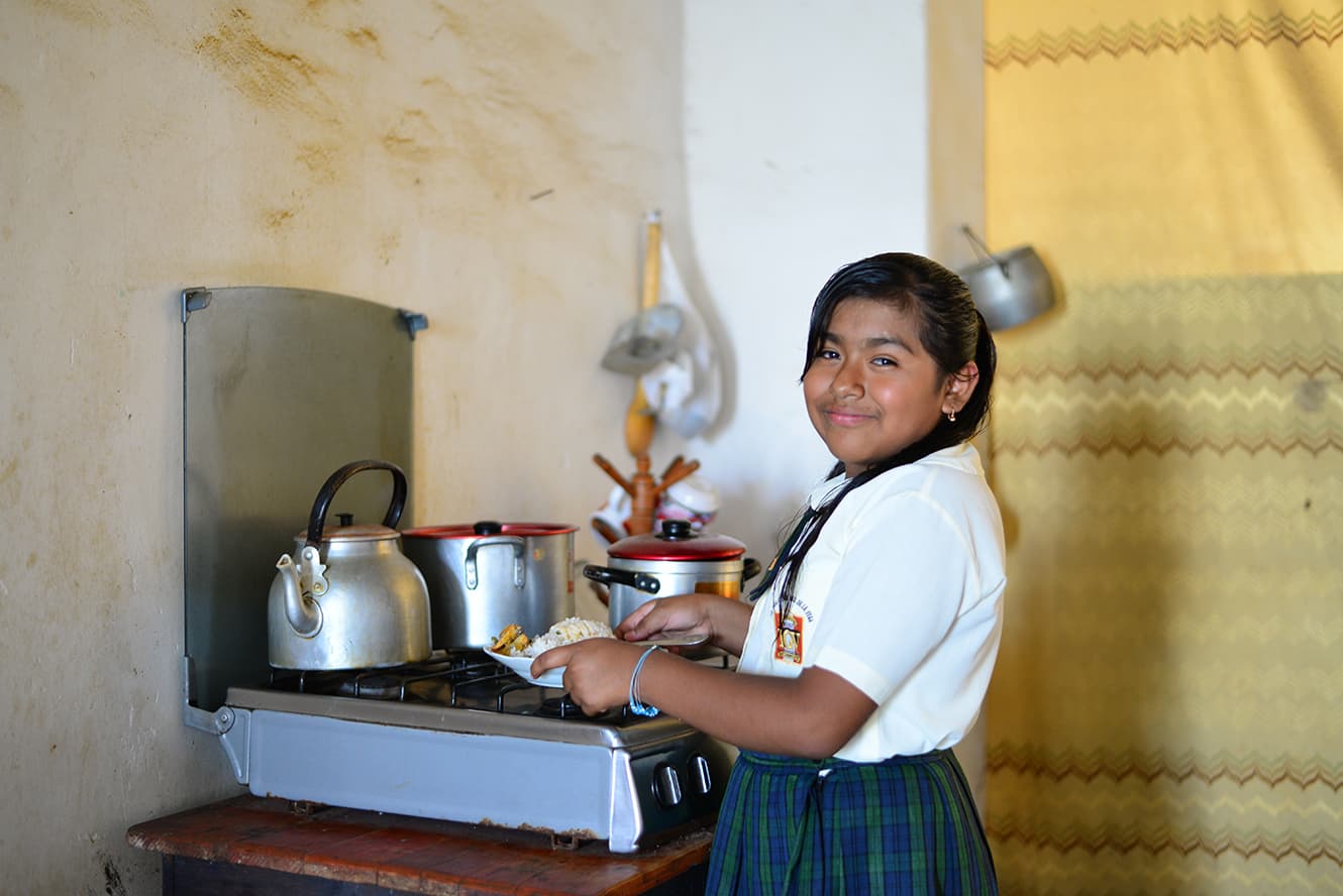 Maria helping with cooking