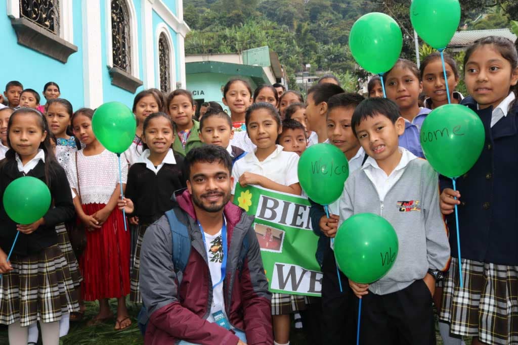 Vino, Compassion supporter, surrounded by youth