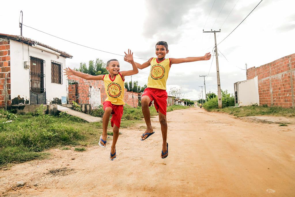 Francisco and his friend jumping joyfully