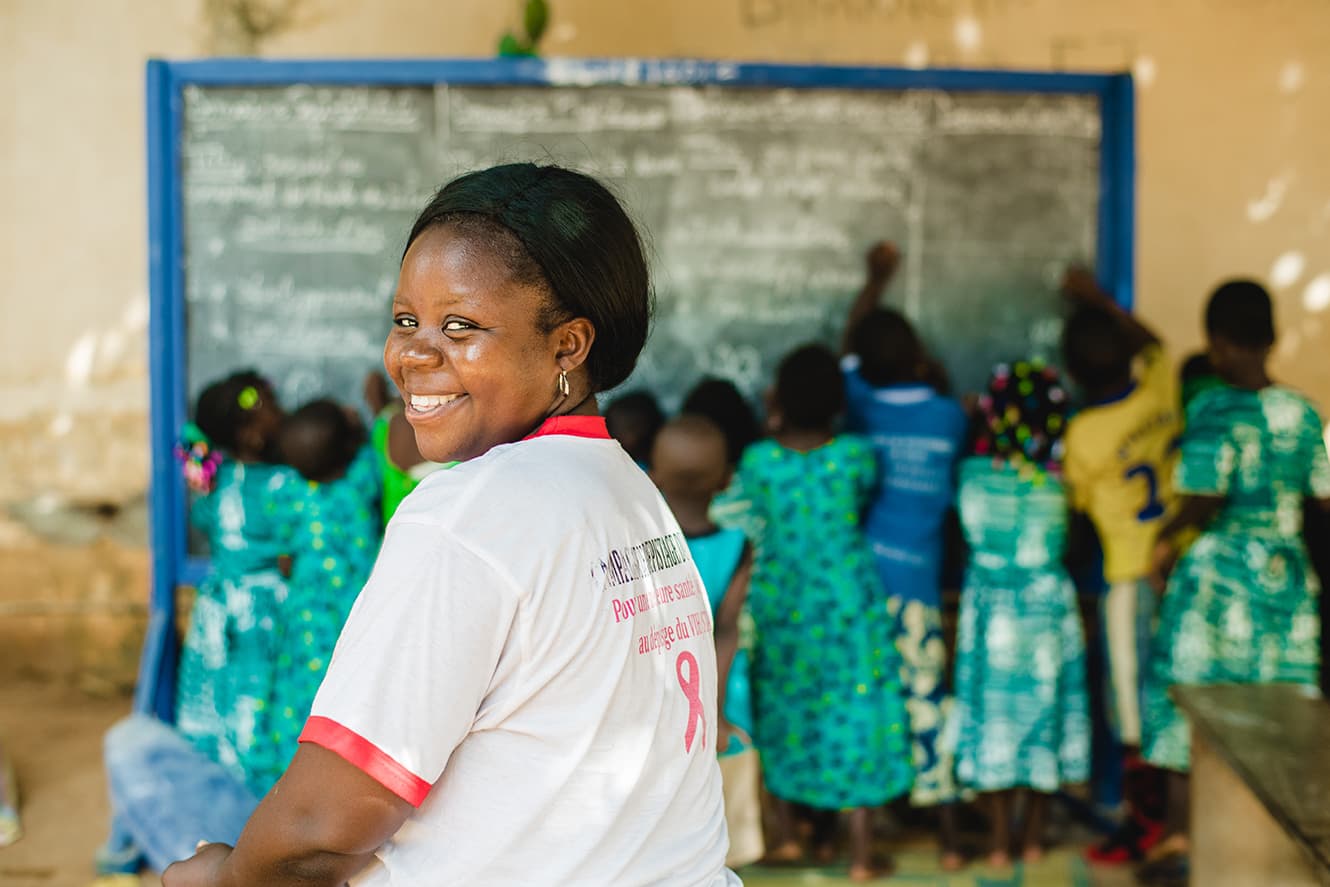 justine togo school teacher in classroom
