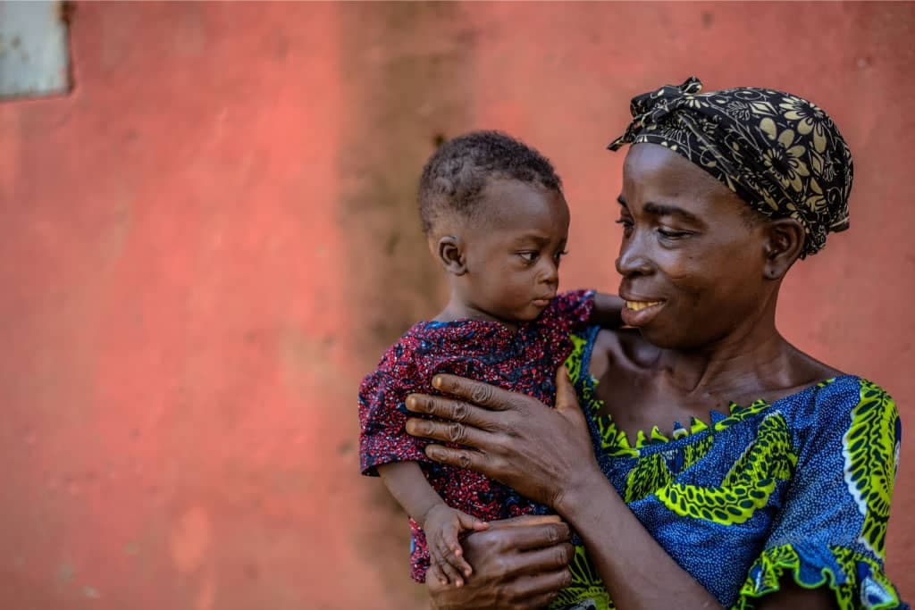 Ankouvi looks at her baby