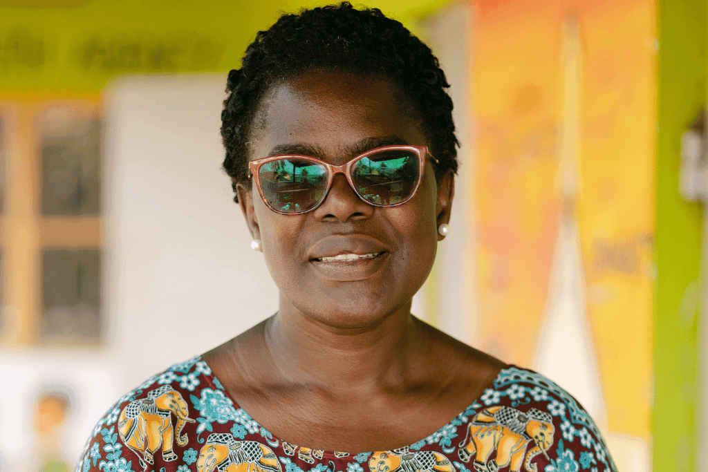Jacquie, Compassion project director in Mbale. She is pictured here smiling with her glasses on.