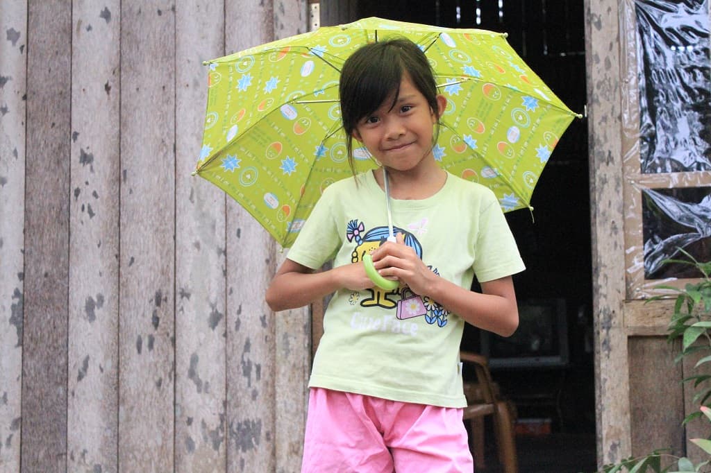 Indonesian girl holding an umbrella