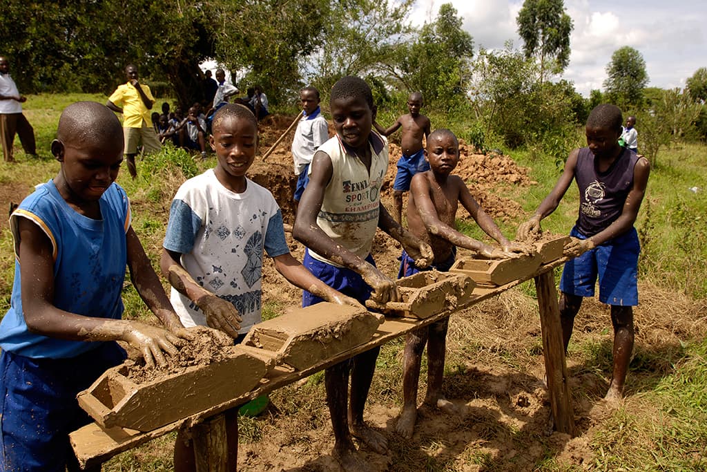 Boys making bricks