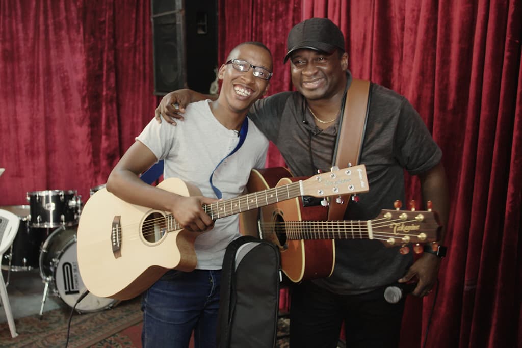 Noel Robinson teaching guitar