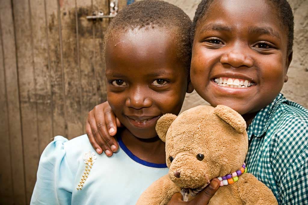Sisters with a teddy bear