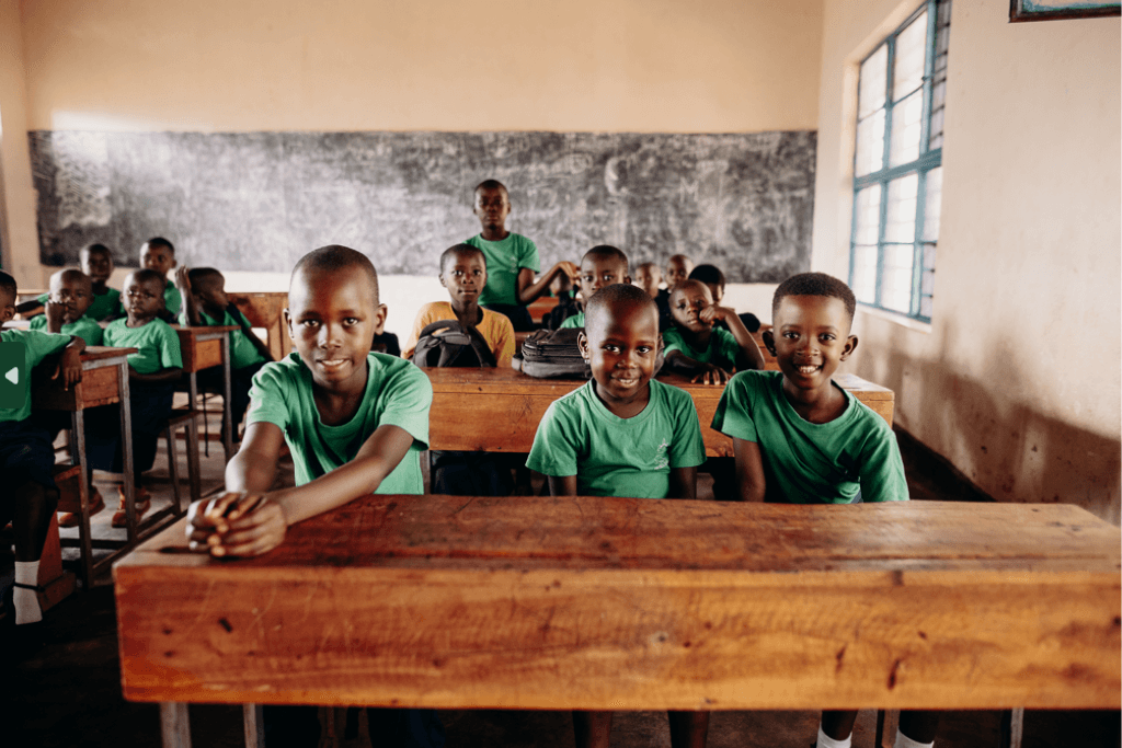Children sat at a desk during their first class