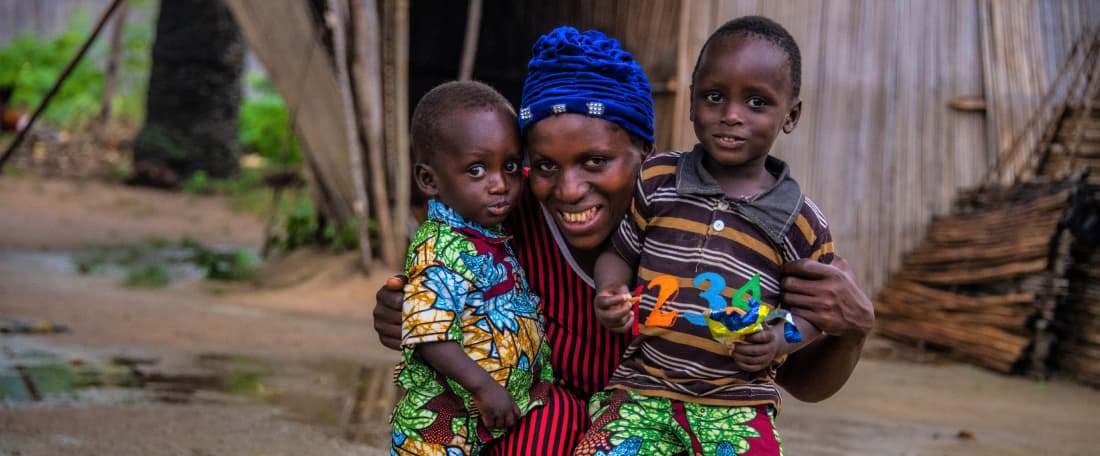 Ama hugs her two sons f