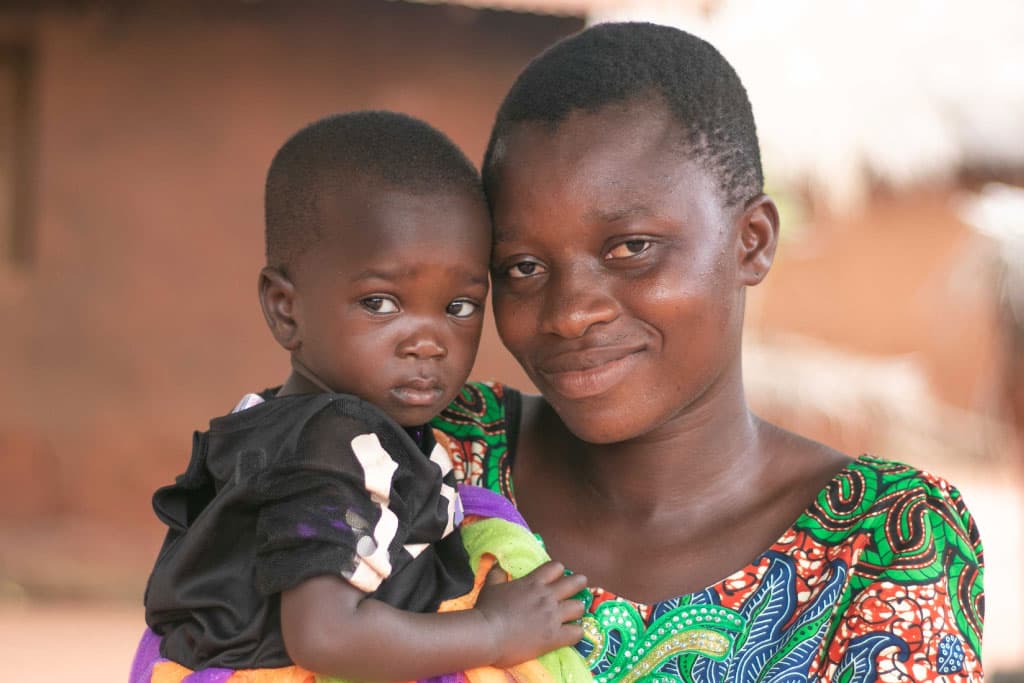 Mother Rebecca holds her baby Akouvi