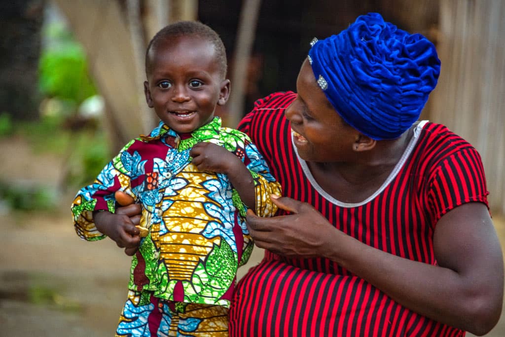 Ama smiles at her infant son