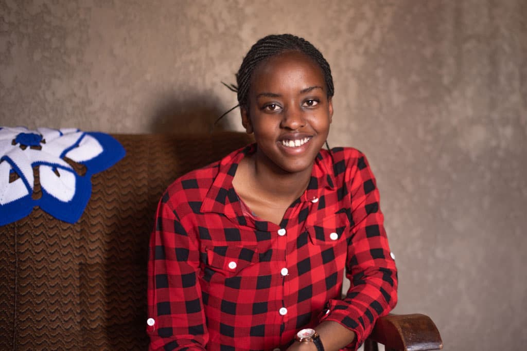 Philomene smiles at her home