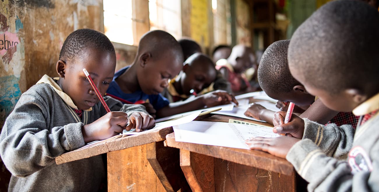 boys studying in Uganda