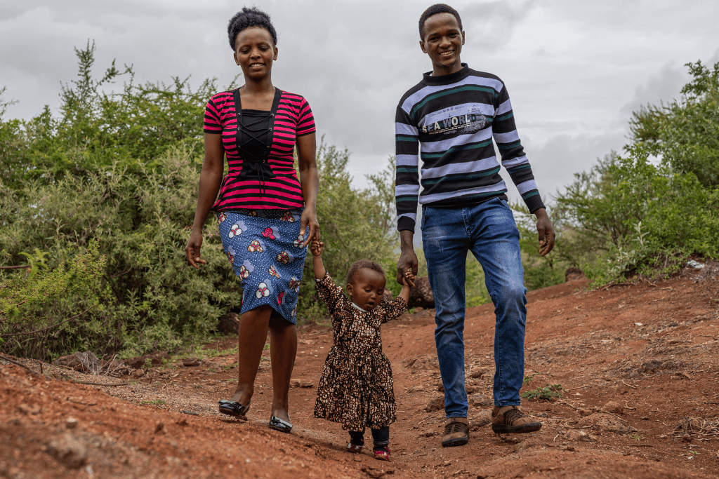 Emmanuel with his wife and daughter