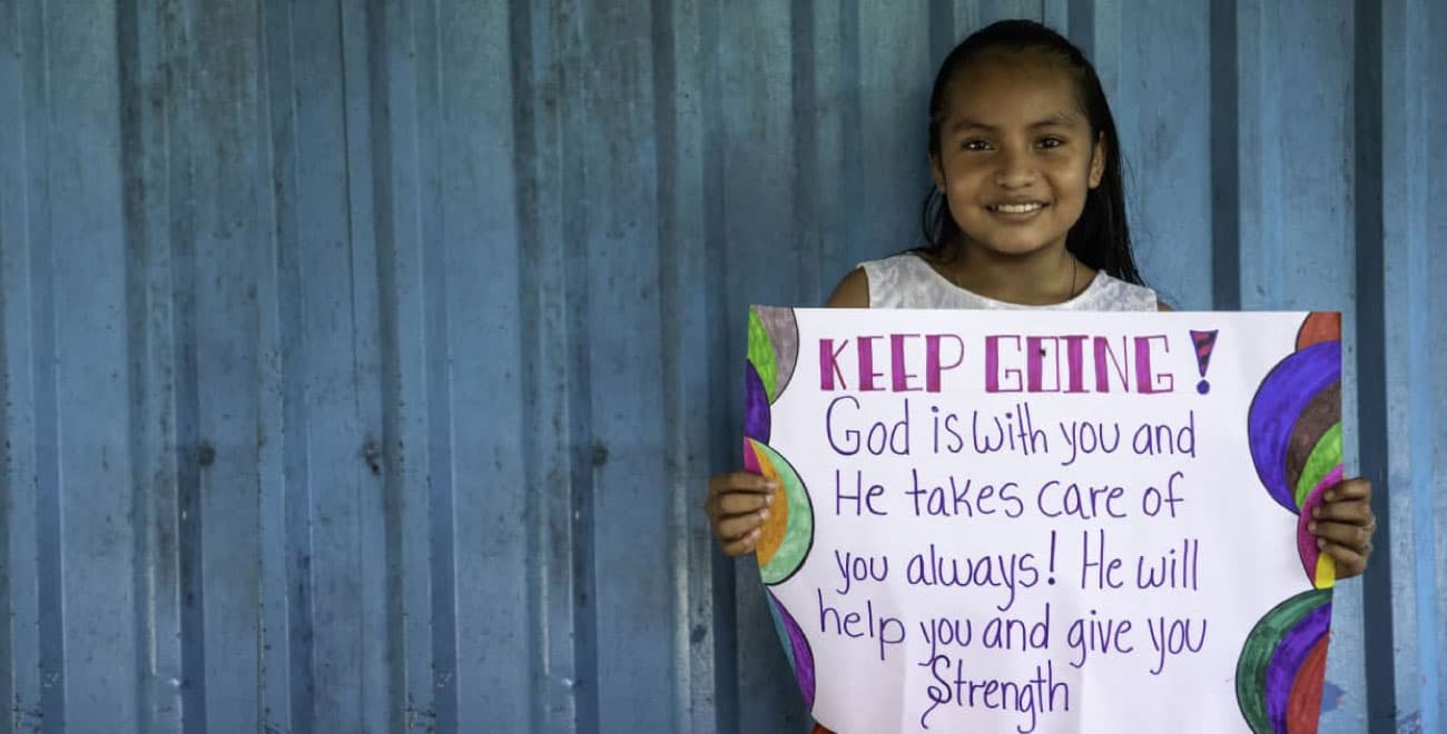 Girl holds prayer about strength f