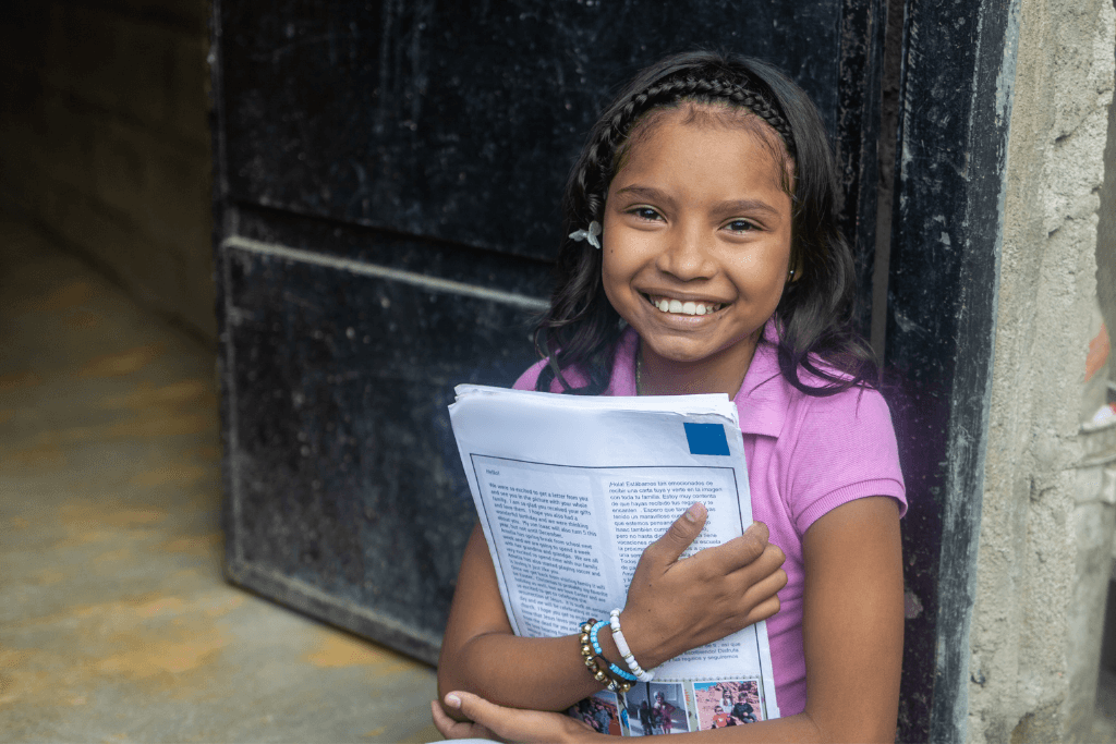 Sofy loves reading the letters from her sponsor