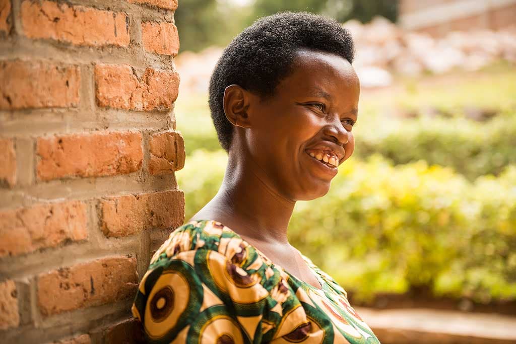 Chantal from Rwanda leaning against wall