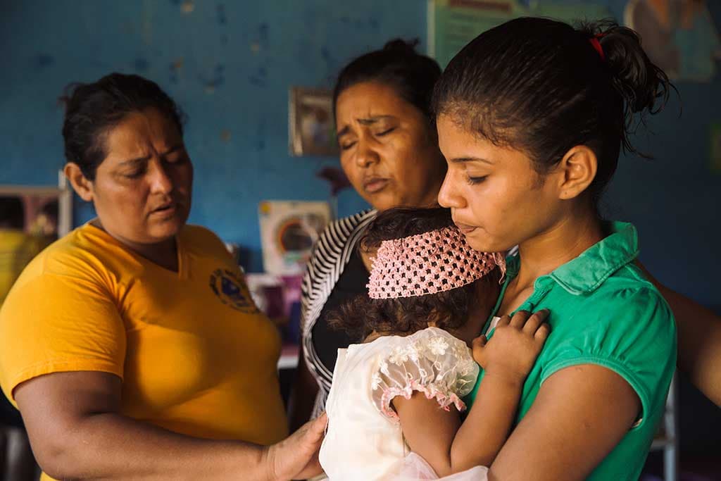 Praying at Compassion project