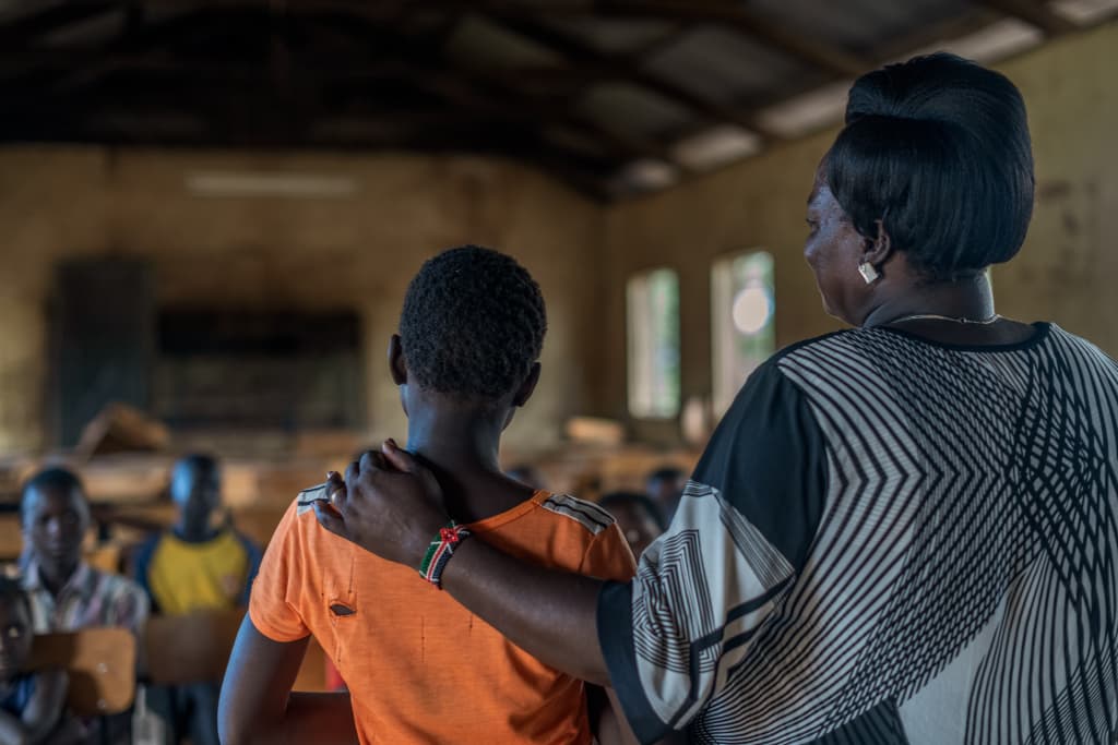 teacher and child in classroom