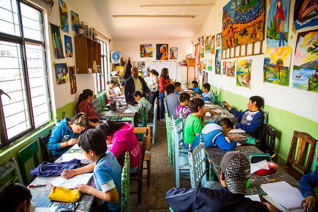 Children exploring their artistic side in a classroom in Mexico