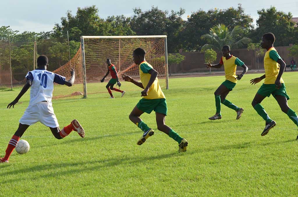 Boys playing football in Burkina Faso