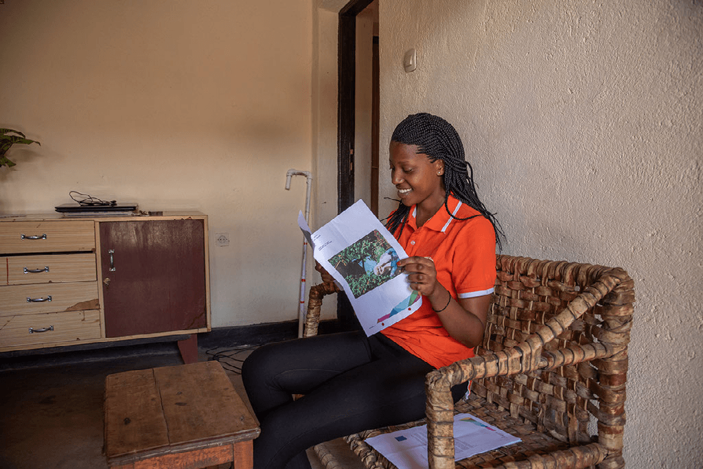 Yvette reads a letter from her sponsor.