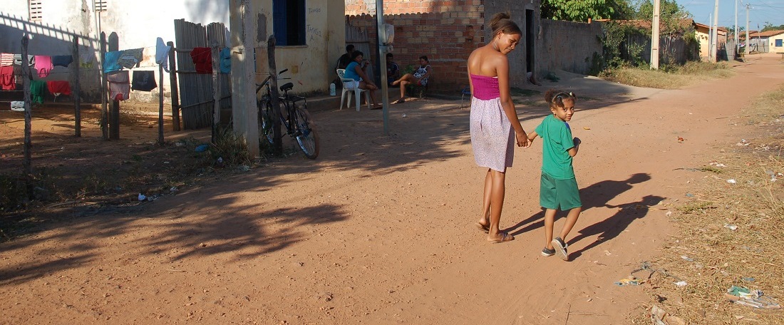 Brazilian mother walking with her child