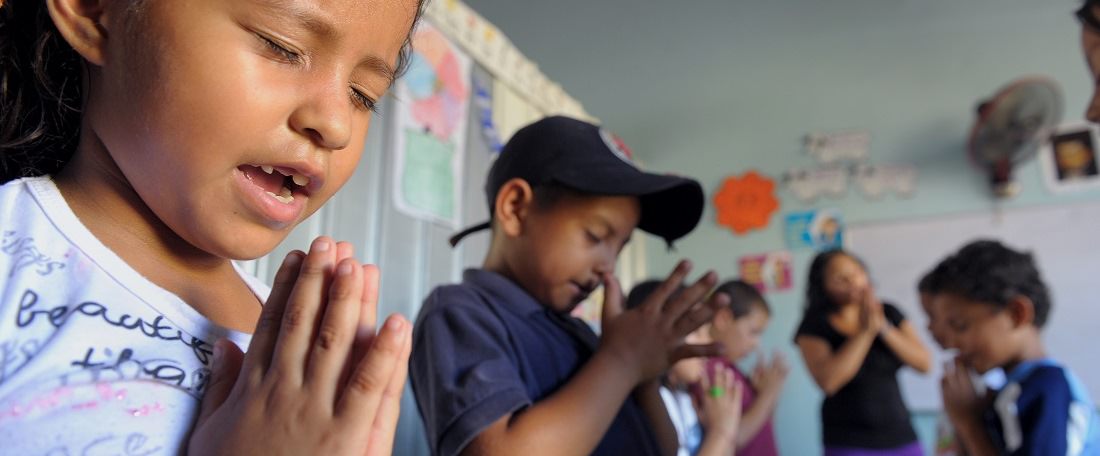 Children in Honduras praying