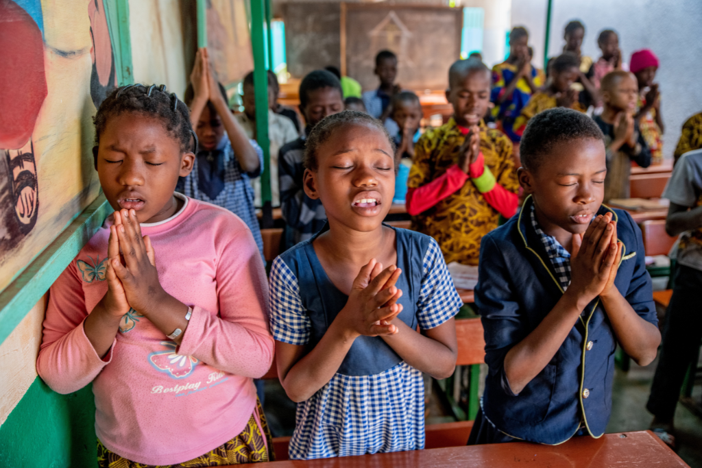 Children pray together