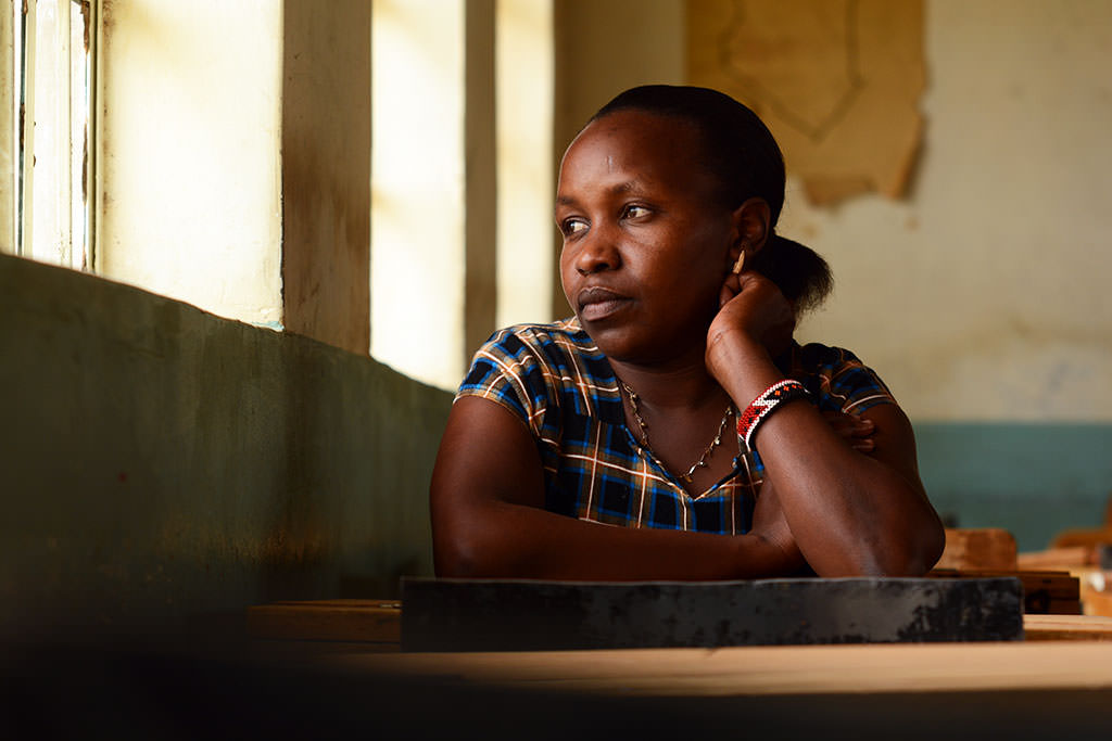 Jennifer sits in a Kenyan classroom