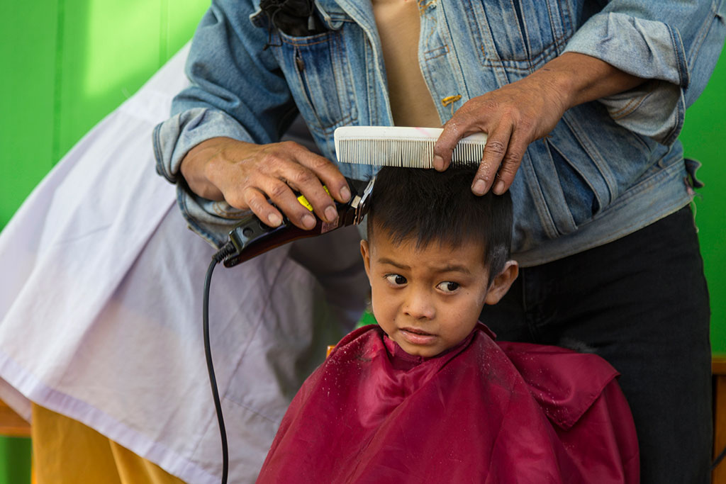 Haircut at a Compassion project