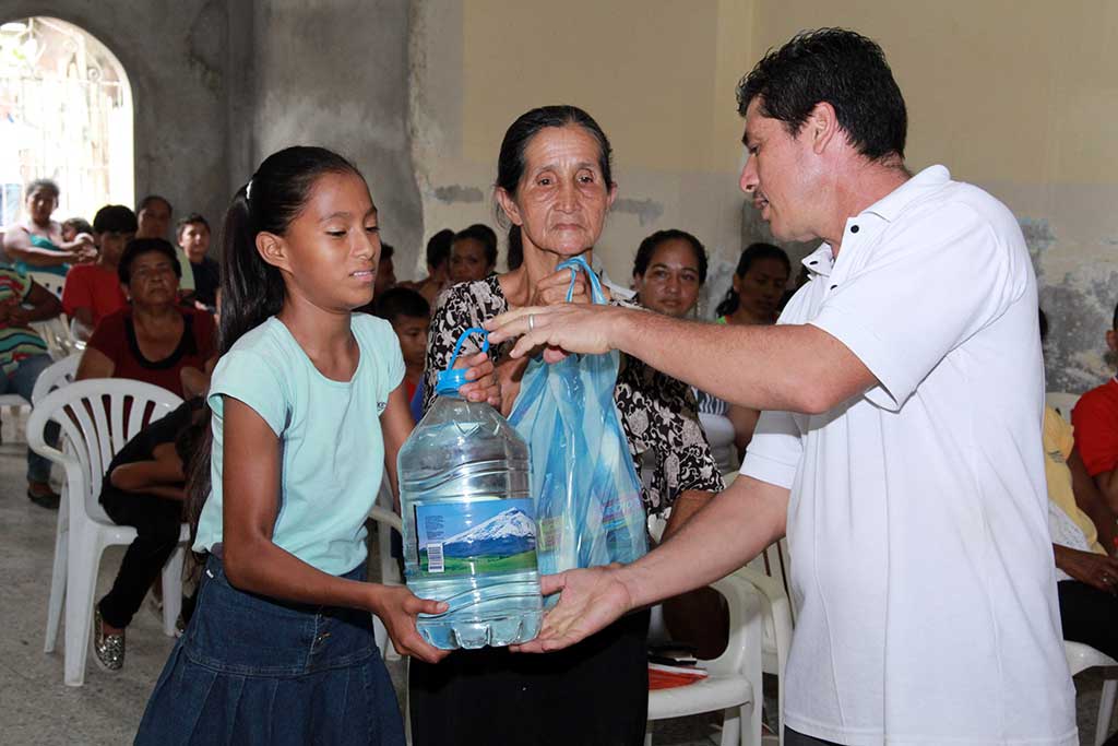 Giving out clean water in Ecuador