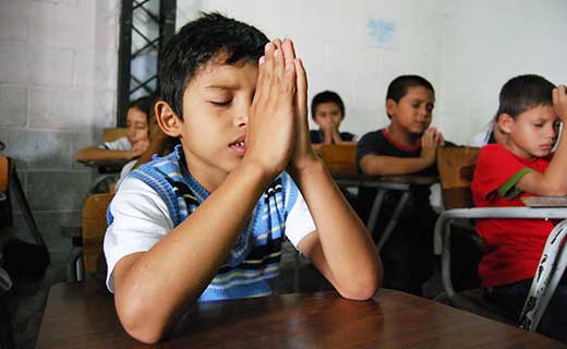 Boy-praying-in-El-Salvador-secondary.jpg