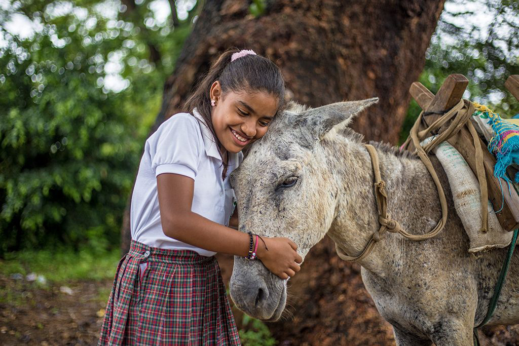 Dianis with her donkey, Mocho. 