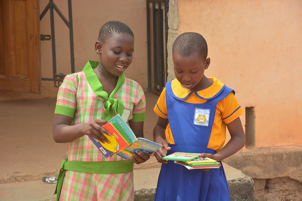 Girls read in Ghana