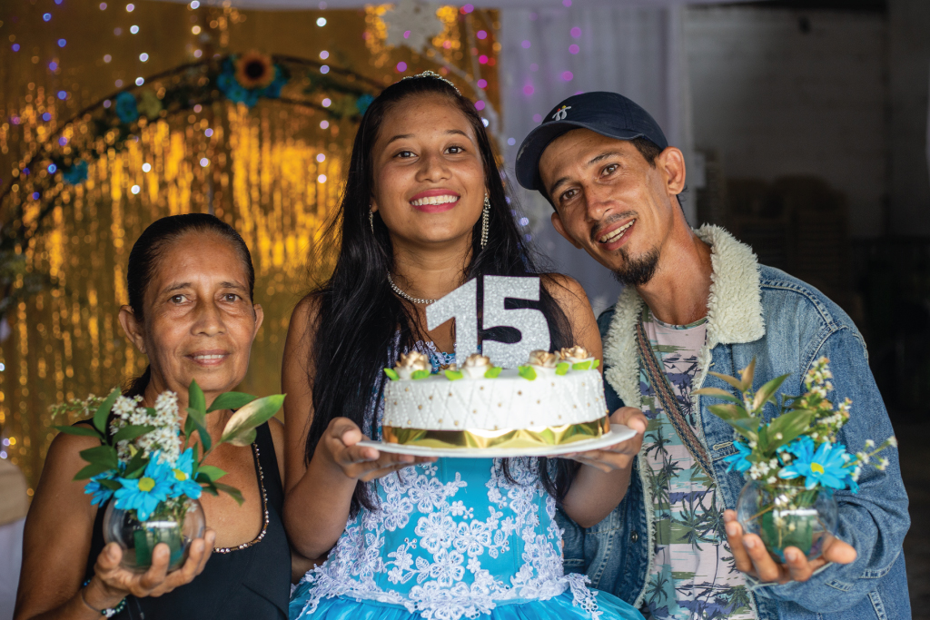 family with birthday cake