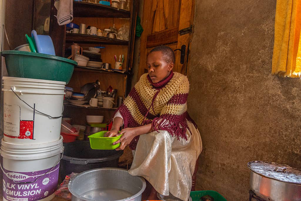 Esther from Tanzania in her kitchen